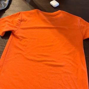 It’s an orange athletic works shirts